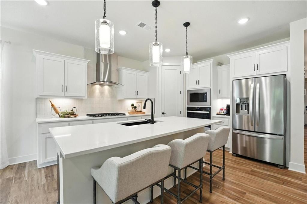 1st image of 1824 Woodward Cir, Raymore, MO 64083 | MLS# 2633667