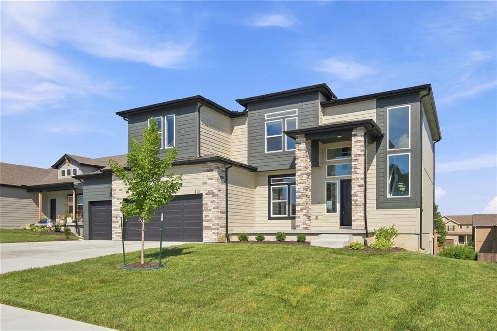 3rd image of 413 Woodview Dr, Raymore, MO 64083 | MLS# 2636061