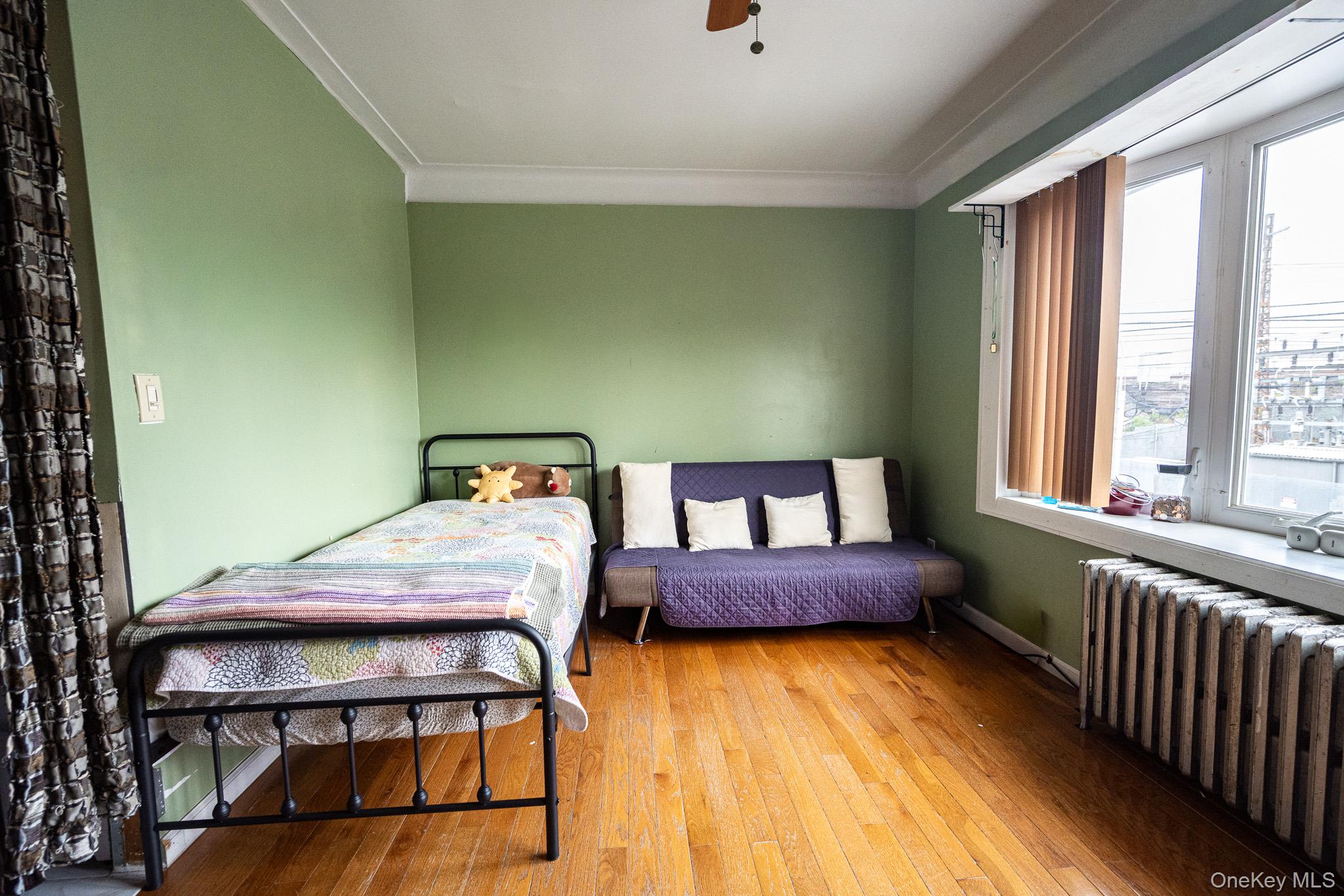 11th image of 38 26 55th St, New York, NY 11377 | MLS# 1036967