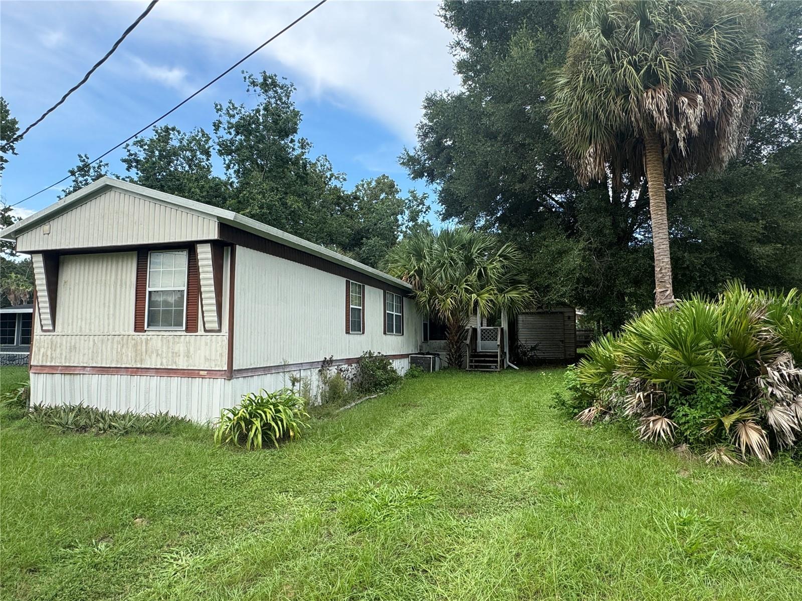 1st image of 3285 Se 131st Pl, Belleview, FL 34420 | MLS# OM729449