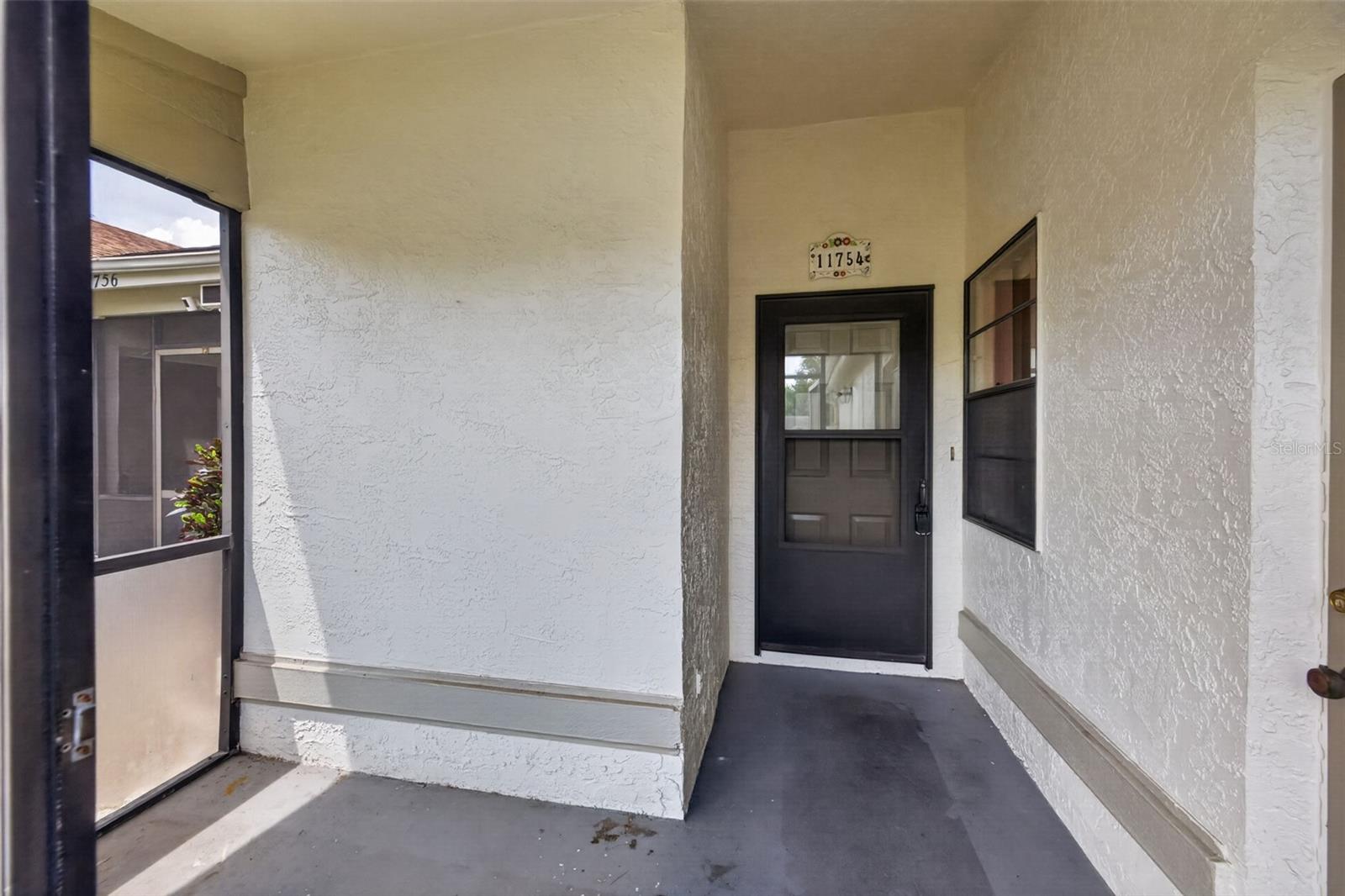 4th image of 11754 Spring Tree Ln, Port Richey, FL 34668 | MLS# TB8537243