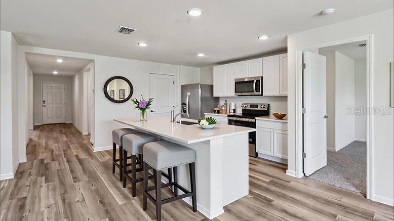 3rd image of 8765 Triumph Cir, Wildwood, FL 34785 | MLS# OM730429