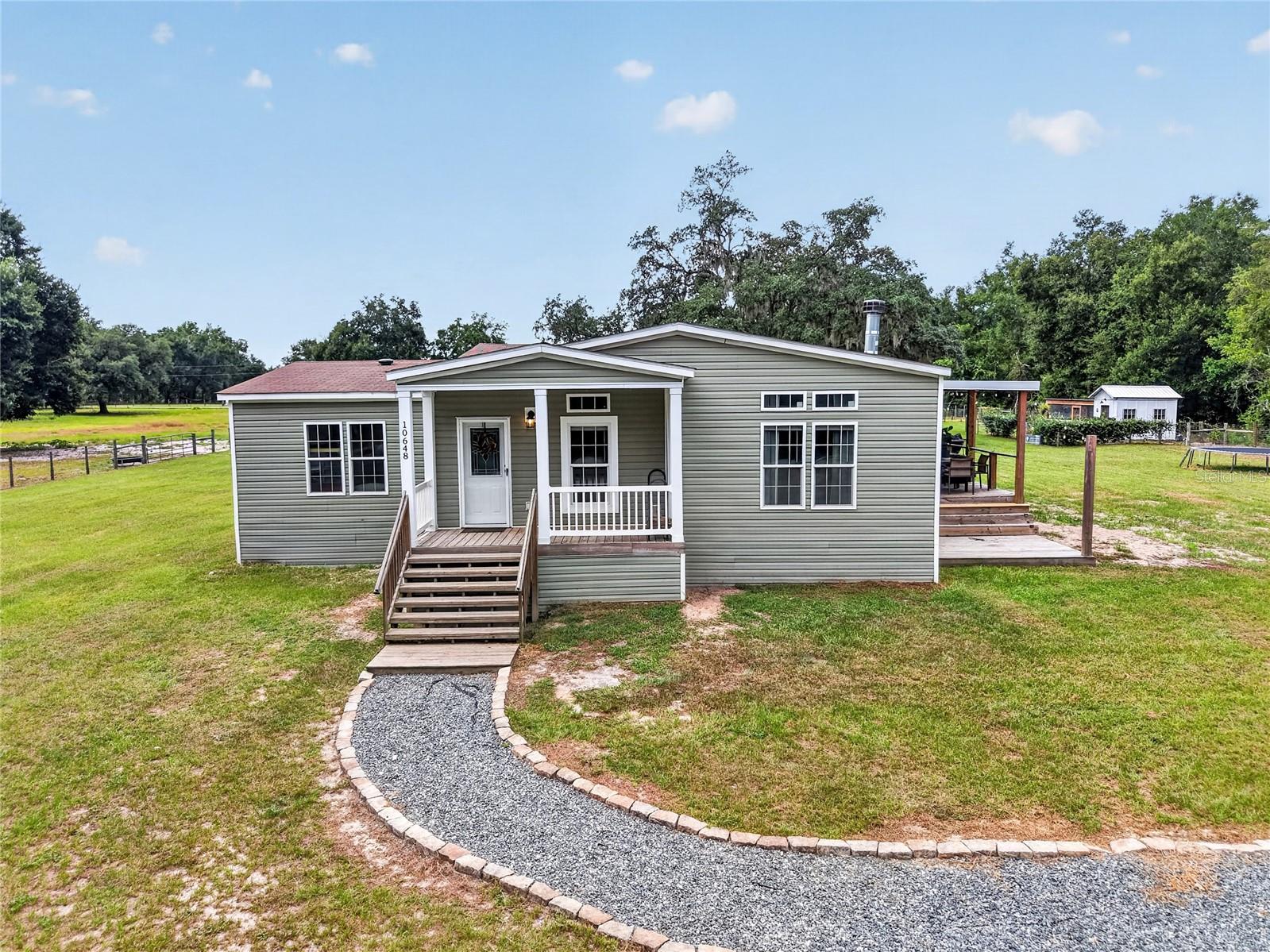 1st image of 10648 Se Hwy 464c, Ocklawaha, FL 32179 | MLS# OM731155