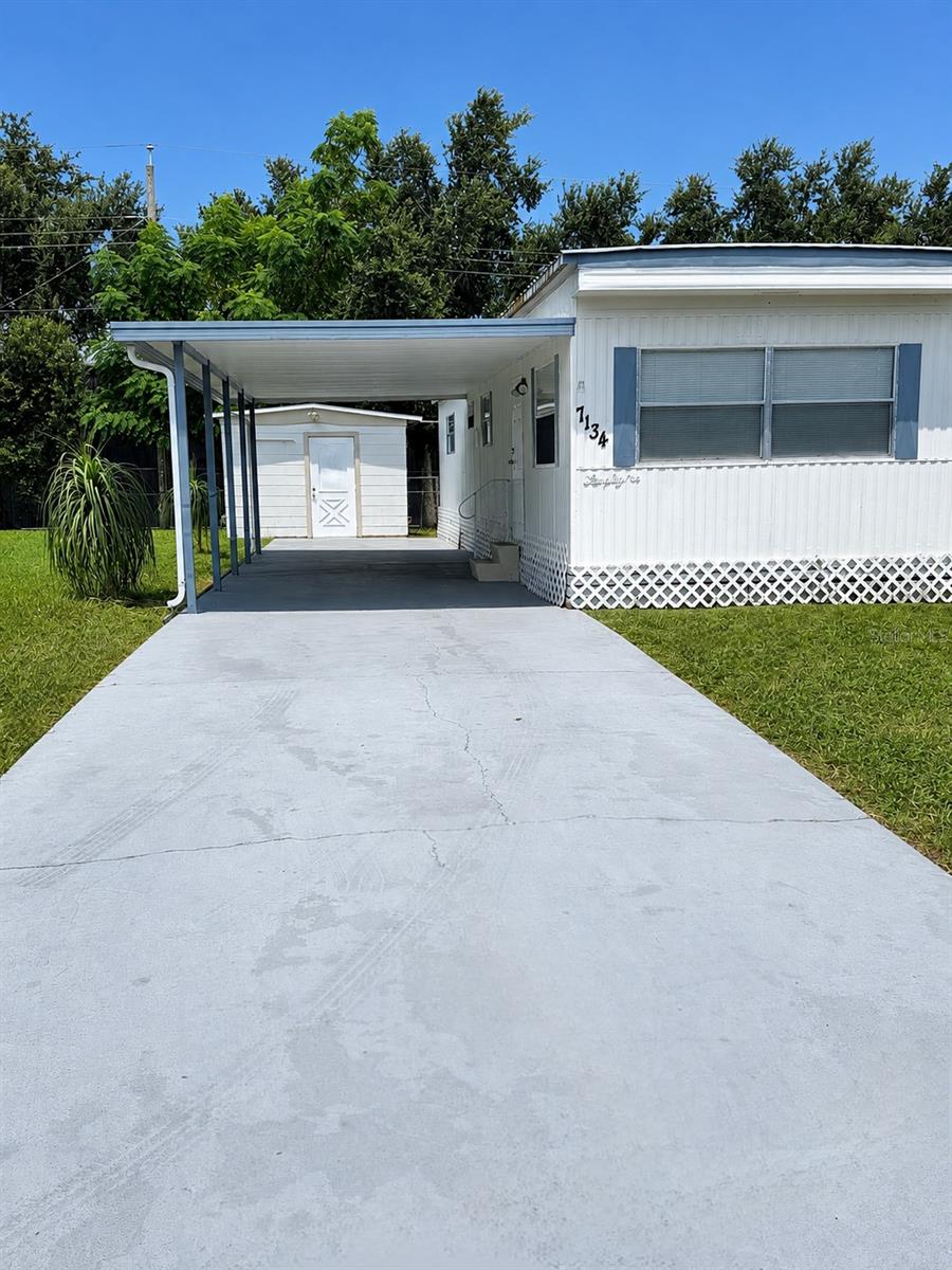 Photo 2 of Manufactured home for sale at 7134 Lofty Dr, Port Richey, FL 34668 | MLS# W7889047 | Listing updated on 2026-09-02