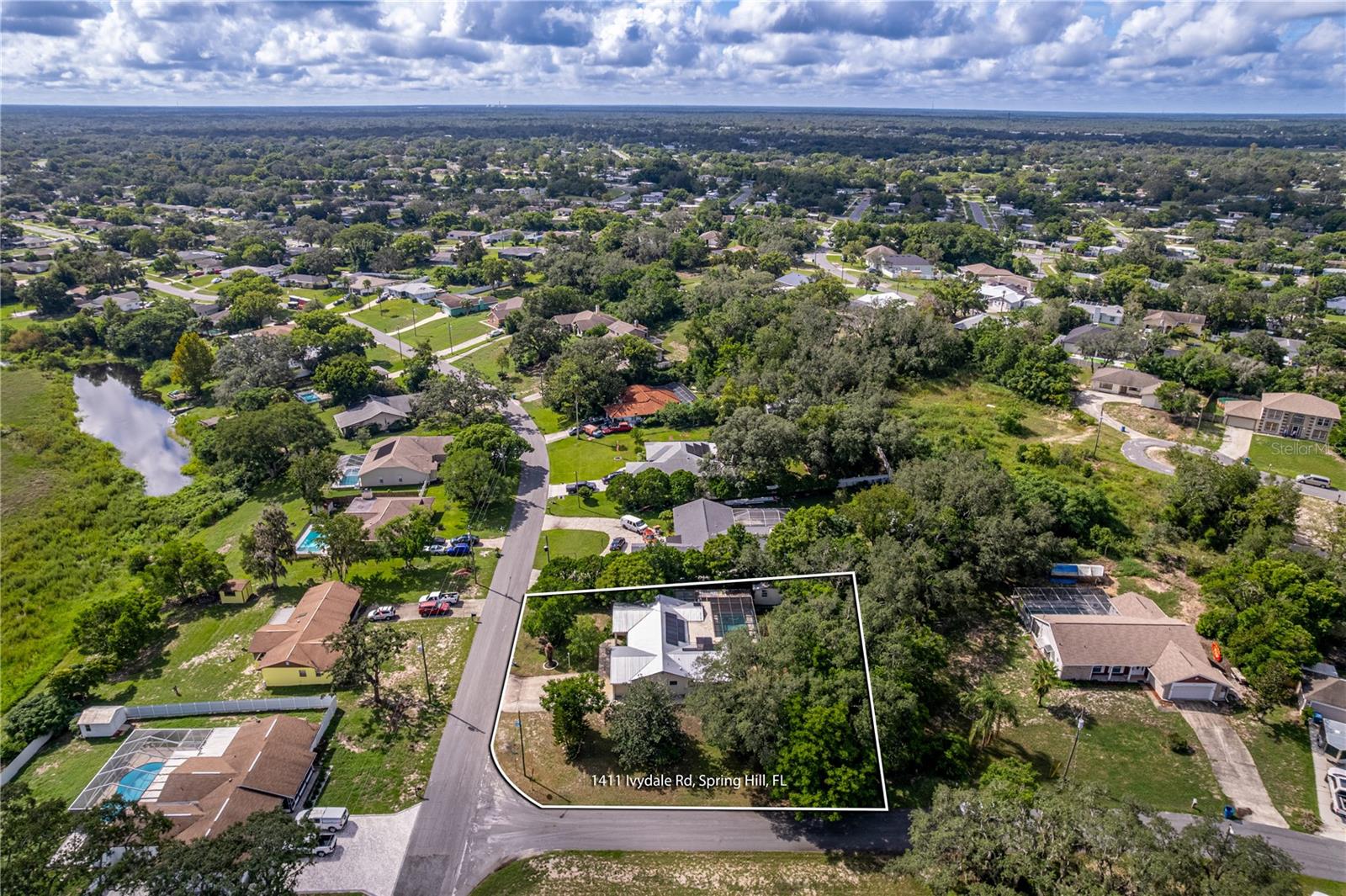 Photo 2 of Single family home for sale at 1411 Ivydale Rd, Spring Hill, FL 34606 | MLS# W7889061 | Listing updated on 2026-09-04